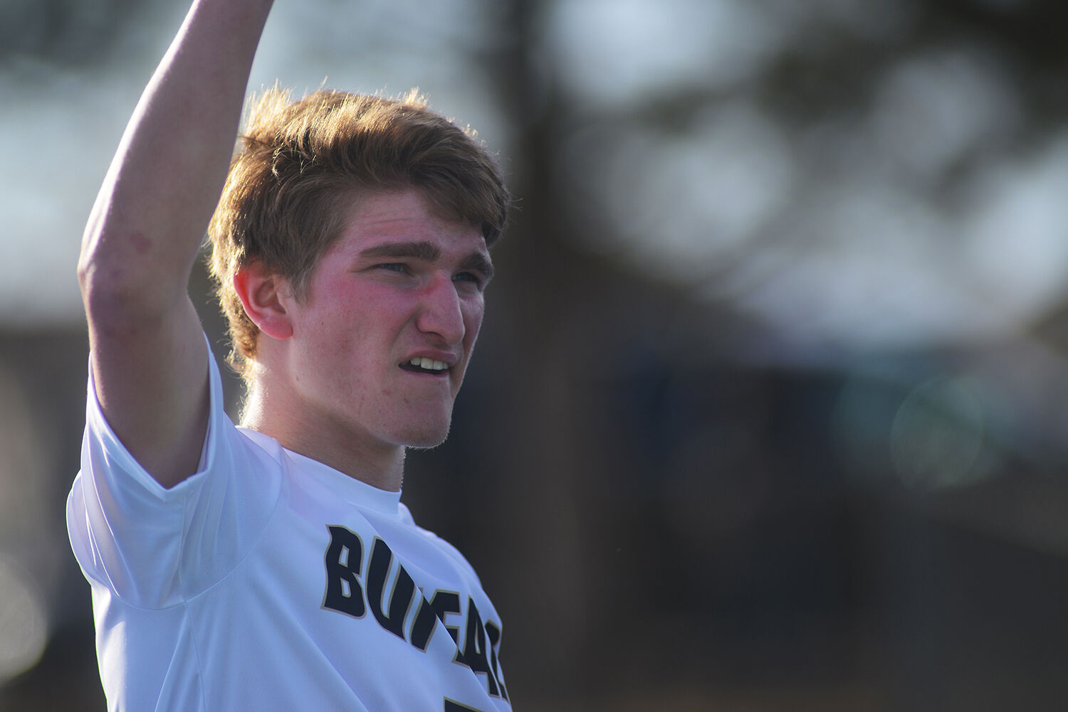 Taylor Swanston holds his arm in the air